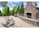 Community brick fireplace with comfortable seating area for outdoor relaxation and entertaining at 1074 Heyward Way, Alpharetta, GA 30009
