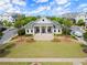 Community clubhouse boasts a covered porch and meticulously landscaped lawn at 1074 Heyward Way, Alpharetta, GA 30009