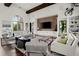 Relax in Harlow Hall's inviting living room with brick accents and community decor at 1074 Heyward Way, Alpharetta, GA 30009