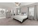 Bright bedroom with a ceiling fan, carpet, and two windows at 1074 Heyward Way, Alpharetta, GA 30009