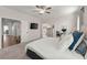 Spacious bedroom with a neutral color palette, and access to a bathroom and sitting room at 1074 Heyward Way, Alpharetta, GA 30009