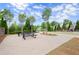 Outdoor picnic area with mature trees and landscaping offers a relaxing space for gatherings at 1074 Heyward Way, Alpharetta, GA 30009