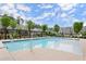 Community pool with sun loungers, pergolas, and landscaping at 1074 Heyward Way, Alpharetta, GA 30009