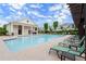 Community pool with lounge chairs and covered area for relaxing on a sunny day at 1074 Heyward Way, Alpharetta, GA 30009