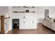 Entertaining wet bar with bar fridge and sports memorabilia display shelves above, great for parties at 1074 Heyward Way, Alpharetta, GA 30009