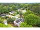 A neighborhood with lush trees, well-kept lawns, and sidewalks at 1328 Wyntercreek Rd, Atlanta, GA 30338