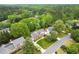 Charming home featuring well-manicured lawns, mature trees, and a welcoming driveway at 1328 Wyntercreek Rd, Atlanta, GA 30338