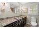 Bathroom featuring granite counters, modern fixtures and tile flooring at 1328 Wyntercreek Rd, Atlanta, GA 30338