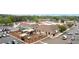 Aerial view of shopping center, playground, with a variety of stores, restaurants, parking and mature trees at 1328 Wyntercreek Rd, Atlanta, GA 30338