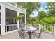 Charming deck with a table and chairs, screened in porch, perfect for enjoying the outdoors at 1328 Wyntercreek Rd, Atlanta, GA 30338