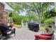 Deck with seating and a grill, perfect for outdoor cooking and entertaining with scenic views at 1328 Wyntercreek Rd, Atlanta, GA 30338