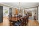 Beautiful dining room with hardwood floors and an open doorway to the home's foyer at 1328 Wyntercreek Rd, Atlanta, GA 30338