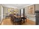 Formal dining room with a large table, chandelier, and hardwood floors at 1328 Wyntercreek Rd, Atlanta, GA 30338