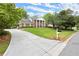 Beautiful two-story brick home featuring a sprawling lawn and grand facade at 1328 Wyntercreek Rd, Atlanta, GA 30338