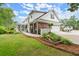 Charming two-story home with manicured lawn, brick accents, and attached garage at 1328 Wyntercreek Rd, Atlanta, GA 30338