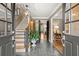 Elegant foyer featuring slate floors, staircase, and view through to the living area at 1328 Wyntercreek Rd, Atlanta, GA 30338