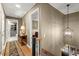 Hallway featuring hardwood floors, elegant decor and stairway with chandelier at 1328 Wyntercreek Rd, Atlanta, GA 30338