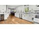 Bright kitchen with white cabinets, a wine fridge, and stainless steel appliances at 1328 Wyntercreek Rd, Atlanta, GA 30338