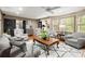 Cozy living room featuring hardwood floors, soft seating, and natural lighting at 1328 Wyntercreek Rd, Atlanta, GA 30338