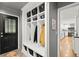 Mudroom with custom built-in storage cubbies and hooks for organization at 1328 Wyntercreek Rd, Atlanta, GA 30338