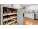 Spacious pantry with pull-out shelving for optimized storage and organization at 1328 Wyntercreek Rd, Atlanta, GA 30338