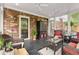 Covered porch featuring multiple ceiling fans and an arrangement of seating at 1328 Wyntercreek Rd, Atlanta, GA 30338