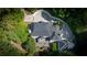 Aerial view showcasing the expansive property, lush landscaping, and circular driveway at 1658 Mount Paran Nw Rd, Atlanta, GA 30327