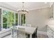 Bright dining area with a chandelier and large window with outdoor views at 1658 Mount Paran Nw Rd, Atlanta, GA 30327