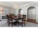 Elegant dining room featuring a round table, chandelier, and arched doorways at 1658 Mount Paran Nw Rd, Atlanta, GA 30327