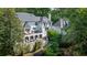 Back of house with brick arches supporting a deck with an upper deck above at 1658 Mount Paran Nw Rd, Atlanta, GA 30327