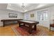 Spacious game room with shuffleboard, pool table, and natural light from the doors leading outdoors at 1658 Mount Paran Nw Rd, Atlanta, GA 30327