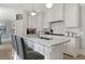 Bright kitchen with white cabinets, marble countertops, and a center island with seating at 1658 Mount Paran Nw Rd, Atlanta, GA 30327