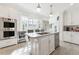 Spacious white kitchen featuring stainless steel appliances and a marble-top island at 1658 Mount Paran Nw Rd, Atlanta, GA 30327
