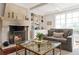 Cozy living room featuring a stone fireplace, built-in bookshelves, and comfortable seating at 1658 Mount Paran Nw Rd, Atlanta, GA 30327