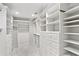 Luxurious walk-in closet with custom shelving, drawers, and ample storage space at 1658 Mount Paran Nw Rd, Atlanta, GA 30327
