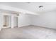 Large basement with neutral carpet, two doors and closet at 1721 Druids Se Xing, Conyers, GA 30013