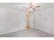Bright bedroom with neutral carpet and two white doors at 1721 Druids Se Xing, Conyers, GA 30013