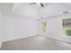 Bedroom with vaulted ceiling, large windows for light and airy feel, neutral walls, and plush carpet at 1721 Druids Se Xing, Conyers, GA 30013