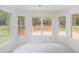 Cozy breakfast nook with large windows, offering views of the surrounding trees and deck at 1721 Druids Se Xing, Conyers, GA 30013