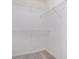 Walk-in closet with carpet flooring and wire shelving for ample storage at 1721 Druids Se Xing, Conyers, GA 30013