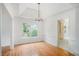Elegant dining room featuring hardwood floors and natural light, ideal for Gathering meals at 1721 Druids Se Xing, Conyers, GA 30013
