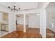 Bright dining room with hardwood floors, offering a glimpse into the open kitchen and living spaces at 1721 Druids Se Xing, Conyers, GA 30013