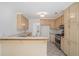 Traditional kitchen with wooden cabinets, featuring a breakfast bar and stainless steel appliances at 1721 Druids Se Xing, Conyers, GA 30013