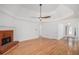 Open living area with a fireplace, hardwood floors, and bright natural light, perfect for relaxing at 1721 Druids Se Xing, Conyers, GA 30013