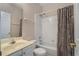 Bathroom with a toilet, sink, shower, and patterned shower curtain at 5 Renfroe Ct, Decatur, GA 30030