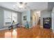 Bonus room featuring wood floors, ceiling fan, windows, and workout equipment at 5 Renfroe Ct, Decatur, GA 30030