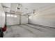 Spacious two car garage with white doors and concrete flooring at 5 Renfroe Ct, Decatur, GA 30030
