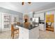 Bright kitchen with stainless appliances, granite counters and an island with seating and french doors at 5 Renfroe Ct, Decatur, GA 30030