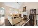 Bright living room with large windows, a fireplace, and dark hardwood floors at 5 Renfroe Ct, Decatur, GA 30030