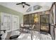 Inviting screened porch features a ceiling fan, comfortable seating area, and access to the back yard at 5 Renfroe Ct, Decatur, GA 30030